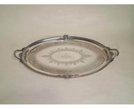 A Victorian silver two handled oval Tea Tray with leafage scroll engraving, four portrait medallions to border, beaded rim, p