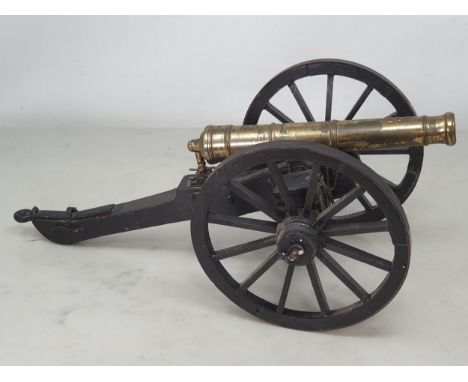 A 20th Century model of a Napoleonic Field Gun, the stained wooden carriage with pair of large spoked wheels, barrel length 8