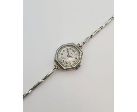 A lady's vintage manual Wristwatch the circular dial with arabic numerals and subsidiary seconds dial in steel octagonal case