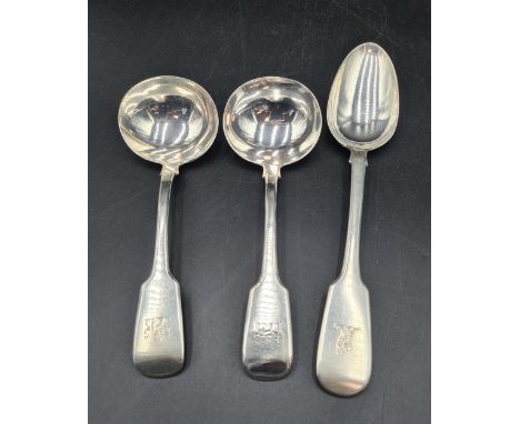 A pair of Victorian silver Sauce Ladles fiddle pattern engraved lion crests, London 1853, and a Table Spoon, London 1839 