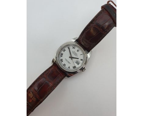 A gentleman's Rolex Oyster Perpetual Datejust Chronometer Wristwatch the white dial with roman numerals, sweep seconds hand a