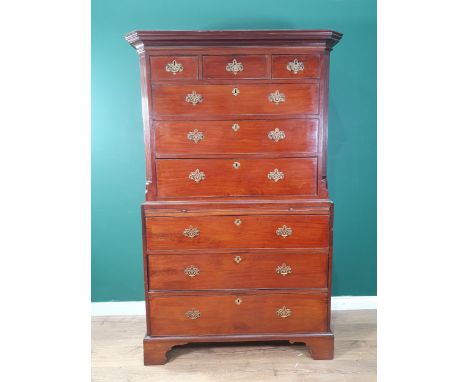 A George III mahogany Chest on Chest the upper section with reeded chamfered corners fitted three short above three graduated