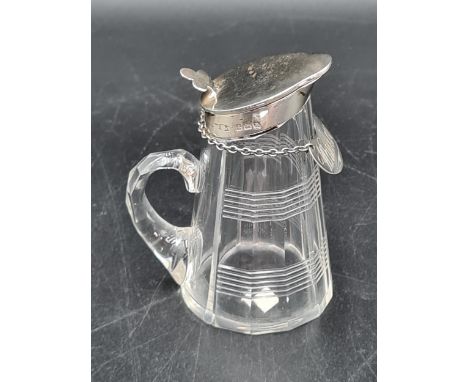 A George V silver lidded cut glass Toddy Flask and a Whiskey Label, Birmingham 1926 