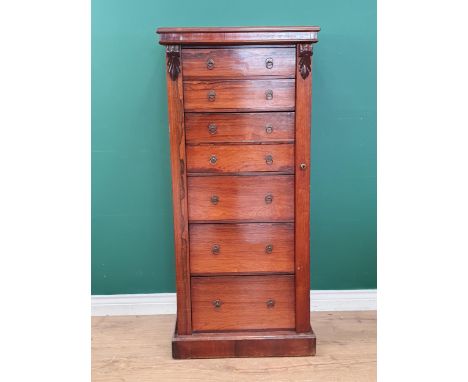A Victorian rosewood Secretaire Wellington Chest with two drawers above the fitted double secretaire drawer and three drawers