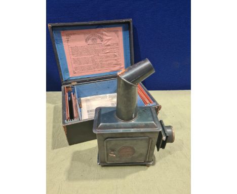 A Gebrauchsanweisung small metal E.P. Slide Projector with selection of coloured glass slides with children playing, hunting 