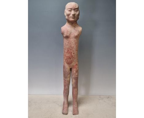 A Chinese clay/terracotta Standing Figure of a Man (possibly Han Dynasty), with wooden bracket supports, A/F, 22"High. 