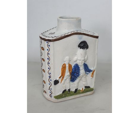 A Prattware Tea Caddy with macaroni moulded figures with painted highlighted decoration (lacking cover), 4 1/2 in H, and a cr