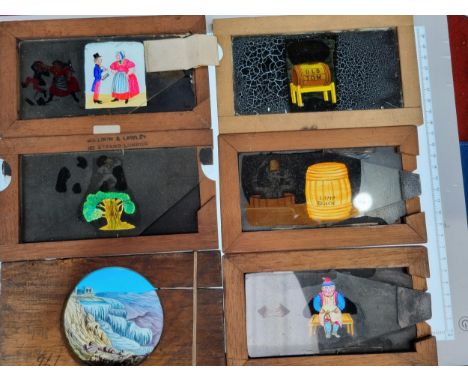 Approximately 40 Magic Lantern Slides with glass sliding section to alter the image, and four other static slides 