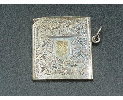 An Edward VII silver Pendant leafage engraved, with vacant cartouche enclosing two oval portrait miniatures, Chester 1904 