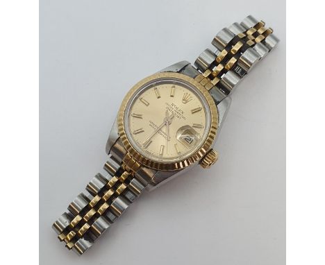 A lady's 1980's Rolex Oyster Perpetual Datejust Wristwatch the brushed gold dial with hourly baton markers, sweep seconds han