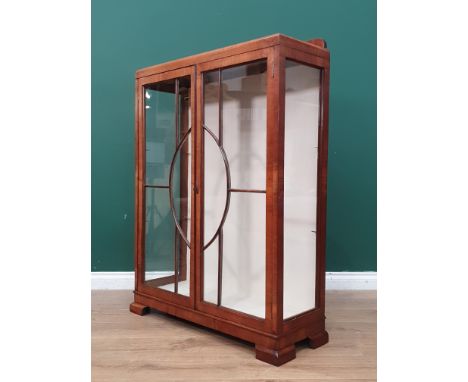 A walnut Art Deco glazed Cabinet with interior glass shelves, on bracket supports, 3ft 11"High x 2ft 11"Wide x 1ft 1"Deep.