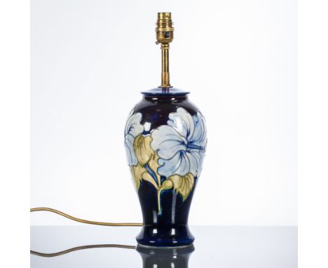 MOORCROFT 'LILY' PATTERN TABLE LAMP
decorated with tube-lined designs in pale blue and green on a dark blue ground, incised f