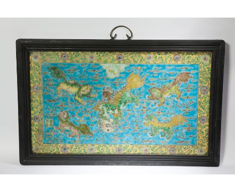 LARGE CHINESE CERAMIC PLAQUE
showing foe dogs in yellow and blue, in wooden frame, 49cm x 80cm overall 