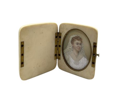 Early 20th century miniature oval head and shoulders portrait on ivory of a lady in her wedding dress in a folding ivory case