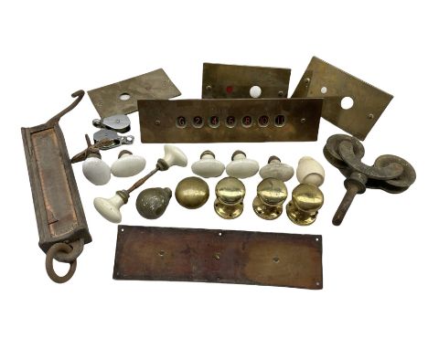 Collection of door furniture including ceramic and brass handles, brass lift plate etc