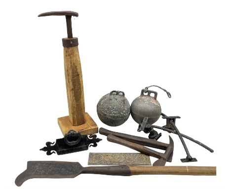 Two vintage aluminium fishing buoys, cast iron letter box front, blacksmiths shoe last mounted on wooden stand, bill hook, va