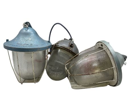 Two 20th century industrial bulkhead pendant ceiling hanging lights by Polam-Gdansk and another similar pendant light fitting