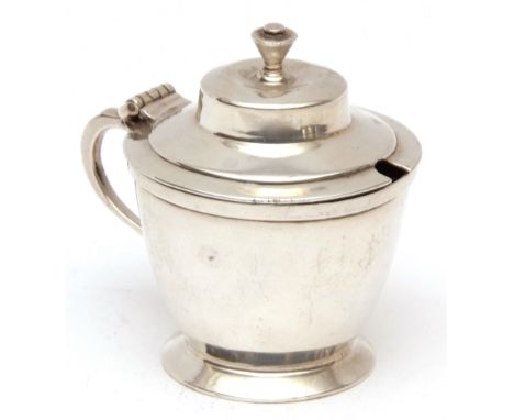 George V lidded mustard of tapering form with hinged and stepped cover with cast finial and side handle on a flared foot, fit