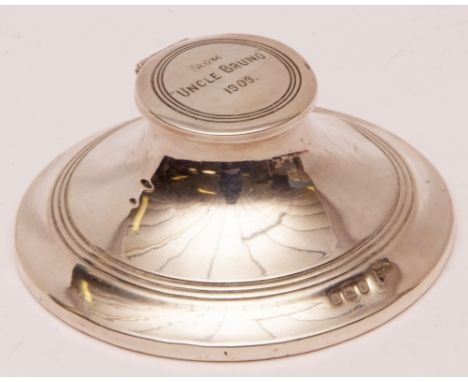 Edward VII capstan inkwell of typical form with hinged cover engraved "From Uncle Bruno, 1909" (loaded), diam 3 1/2 ins 