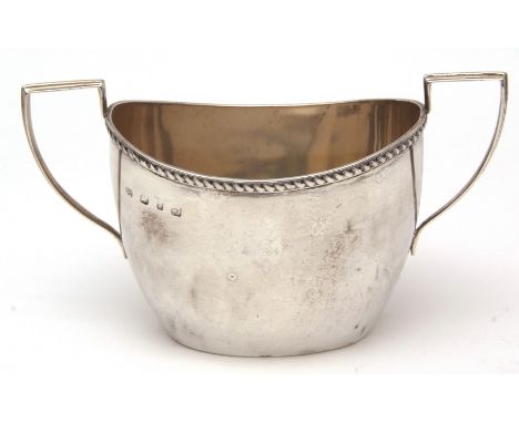 Late Victorian two-handled sugar basin of polished oval form with strapwork handles and gadrooned border, width 6 1/4 ins, we