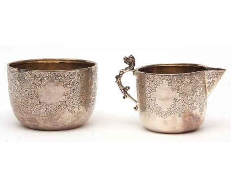 Victorian milk jug and sugar basin, each of plain circular form with engraved floral, foliate and bird detail, combined weigh