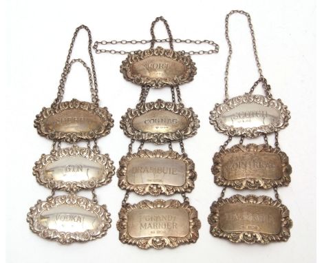 Mixed Lot: six matched decanter labels, each of embossed oval form with chain suspension, together with four further shaped r