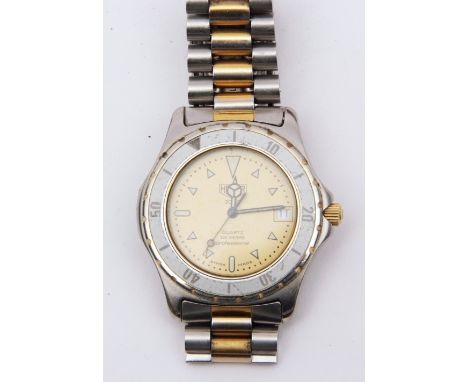 Last quarter of 20th century stainless steel centre seconds quartz calendar wristwatch, Heuer 2000, quartz movement to a sign