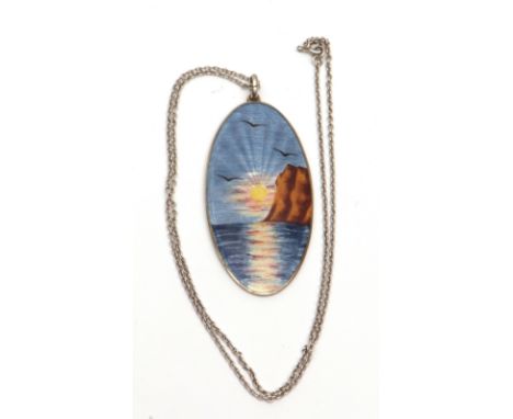 Vintage white metal and enamel pendant, circa 1950, large oval panel, 50 x 25mm, having a guilloche enamel scene, sunset over