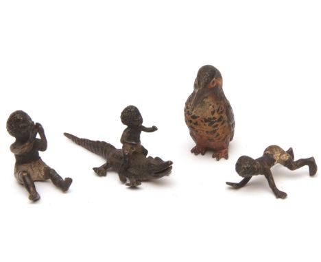 Mixed Lot: cold painted bronze model of a kingfisher, together with three various cold painted bronze models of black childre