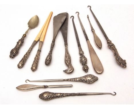 Mixed Lot: five various silver handled button hooks, two manicure pieces, spoon, glove stretchers and two shoe horns, various