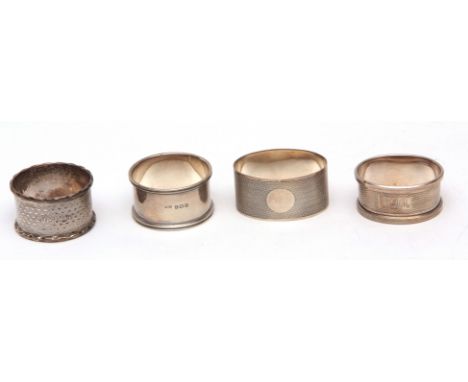 Mixed Lot: four various napkin rings, three uninscribed and with engine turned decoration, combined weight approx 66gms, vari