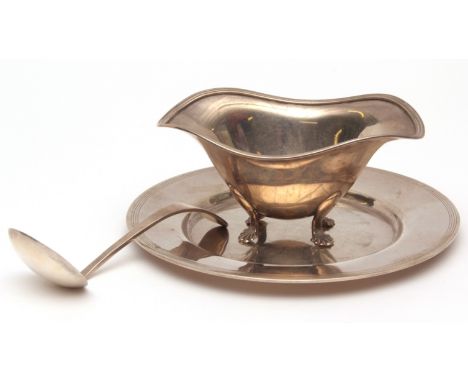 American gravy boat, ladle and circular stand, of polished form with applied and reeded rims and marked for Caldwell & Co and