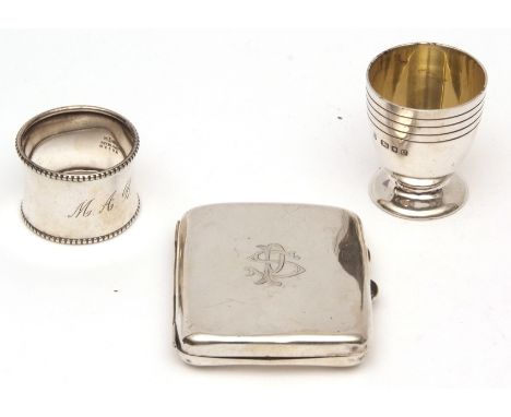 Mixed Lot: Elizabeth II egg cup, together with a waisted cylindrical napkin ring and hinged rectangular cigarette case, combi