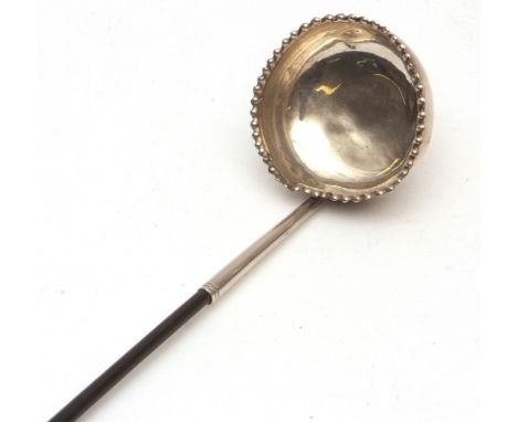 Late 18th/early 19th century whalebone-handled toddy ladle, the circular polished bowl with crimped rim and twisted whalebone