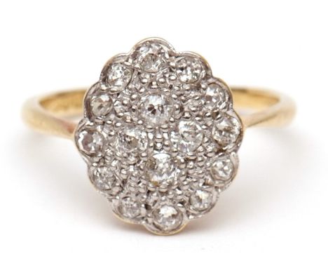 Precious metal diamond cluster ring, the oval panel set with 16 small various cut diamonds, stamped 18ct Plat, finger size K 