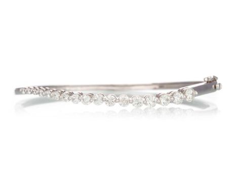 DIAMOND BANGLE, the graduated round brilliant cut diamonds totalling approximately 1.50 carats, marked 14KQty: 10.3gGenerally
