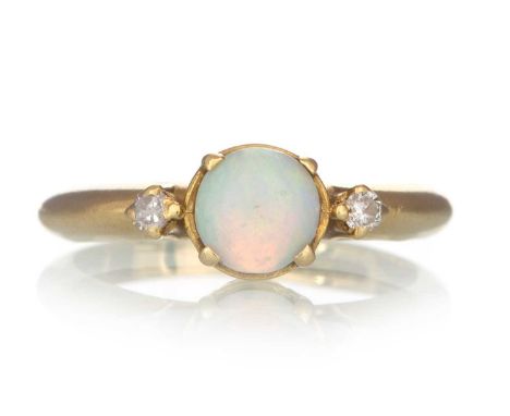 OPAL AND DIAMOND RING, the opal flanked by small diamonds, in eighteen carat gold, size F 1/2Qty: 1.9g