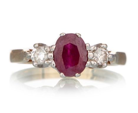 RUBY AND DIAMOND RING, the central ruby flanked by small diamonds, in nine carat gold, size M 1/2Qty: 3.3g