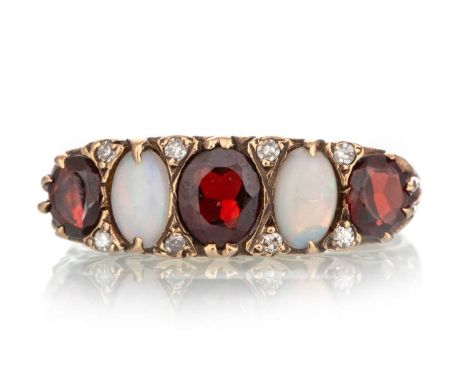 VICTORIAN GARNET AND OPAL RING, set with alternating stones interspaced by diamond chips, in nine carat gold, size T 1/2Qty: 