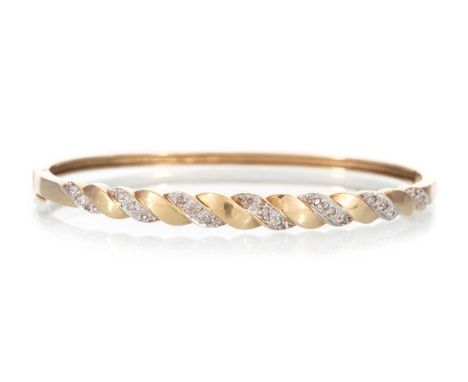 DIAMOND BANGLE, the bicolour sections set with small diamonds totalling approximately 0.15 carats, in nine carat goldQty: 9g