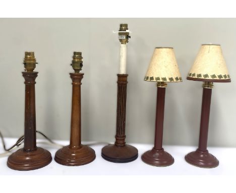 Wooden column style table lamp, 41cm to top of lamp holder, another pair and two lamp style candlesticks, (5).&nbsp;