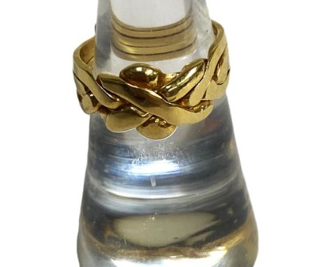 A yellow metal modernist Celtic style ring, size M, marked 18ct, 5.5g.