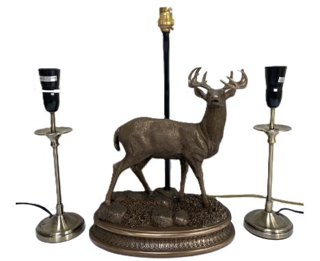 A Coach House table lamp with resin stag base and shade, 67cm, and a pair of candlestick style lamps, (3)