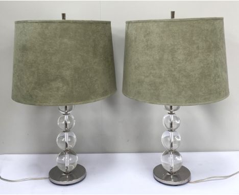 A pair of of heavy contemporary table lamps with two lamp holders on graduated glass ball stem and metal base, 63 cm.&nbsp;