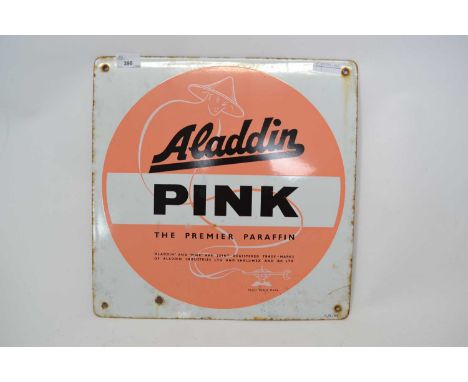 A vintage Aladdin Pink paraffin enamel sign42cm diameterslight rust around screw holes
