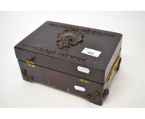 Small wooden box with leaf shell moulded decoration, the interior with a music box polyphon type disc mechanism and discs