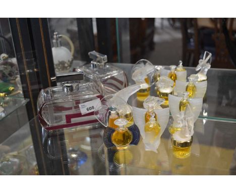 Art Deco glass perfume bottle together with series of small lalique perfume bottles