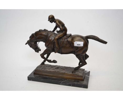 Spelter model of a racehorse and jockey on rectangular onyx base, 30cm long
