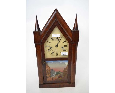A late 19th century mantel clock in wooden architectural case with painted glass panel of a street scene pendulum present.