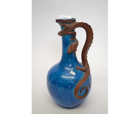 A 19th century Royal Worcester ewer in the Aesthetic style the blue body with sinuous dragon handle impressed factory mark to